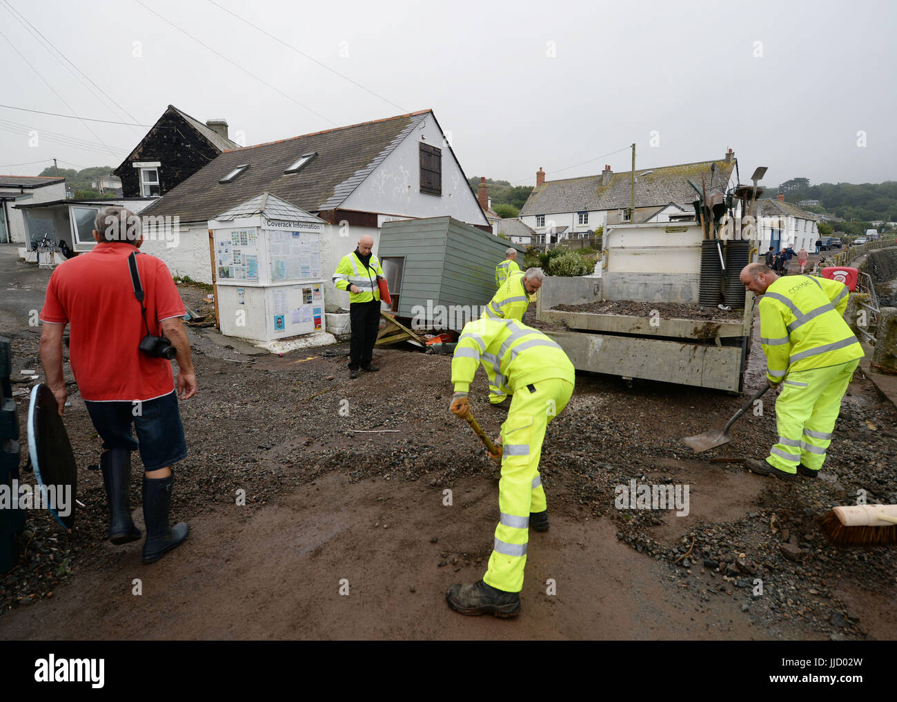 The clear up begins in Coverack, Cornwall, after intense rain caused flash flooding in the coastal village. Stock Photo