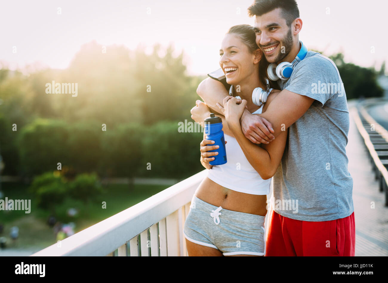 Portrait of man and woman during break of jogging Stock Photo