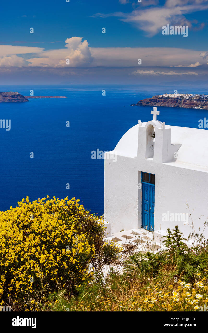 Typical Greek orthodox church in a pretty springtime landscape, Imerovigli, Santorini, South Aegean, Greece Stock Photo
