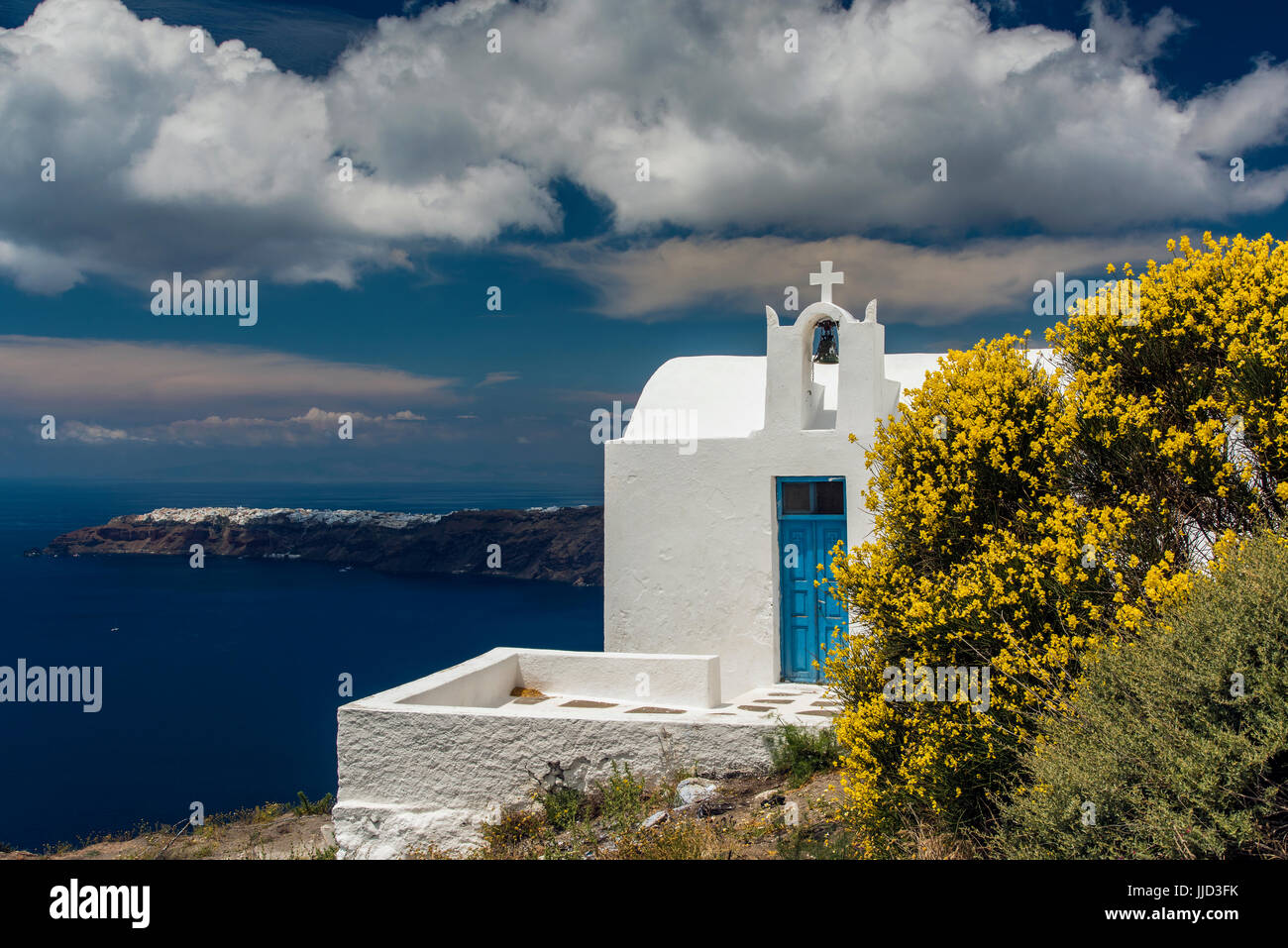 Typical Greek orthodox church in a pretty springtime landscape, Imerovigli, Santorini, South Aegean, Greece Stock Photo