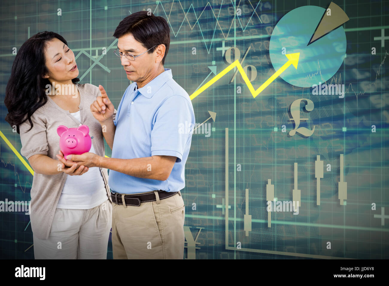 Happy couple holding a piggy bank against red arrow Stock Photo - Alamy
