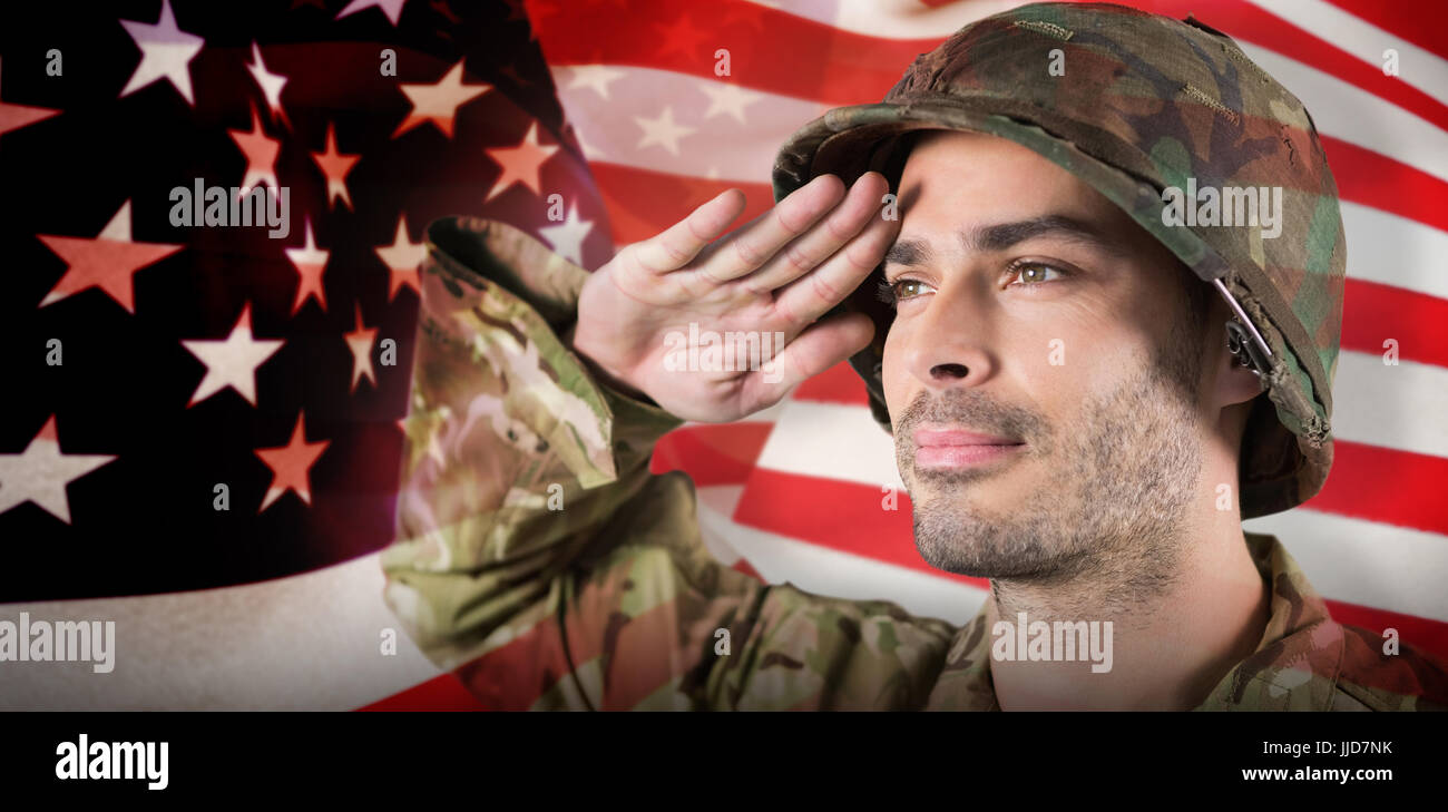 Close up of confident soldier saluting against focus on usa flag Stock ...