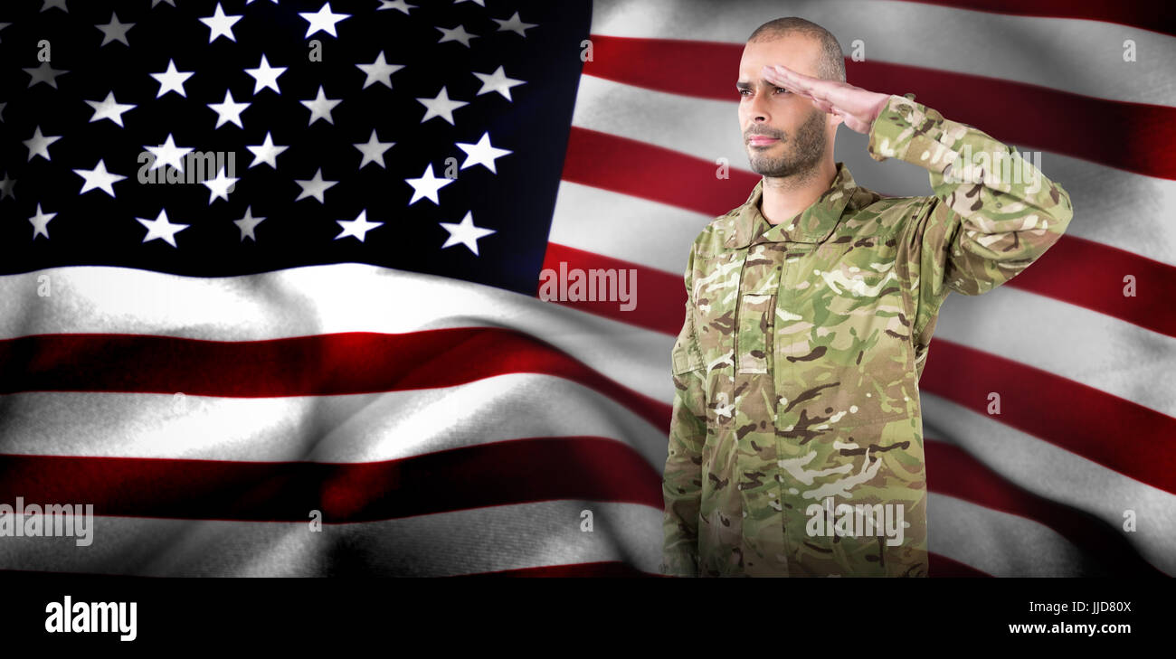 Soldier giving salute against american flag Stock Photo - Alamy
