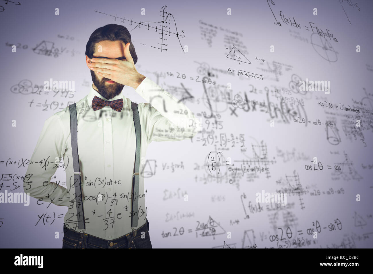 Man covering his face with hand against grey vignette Stock Photo - Alamy