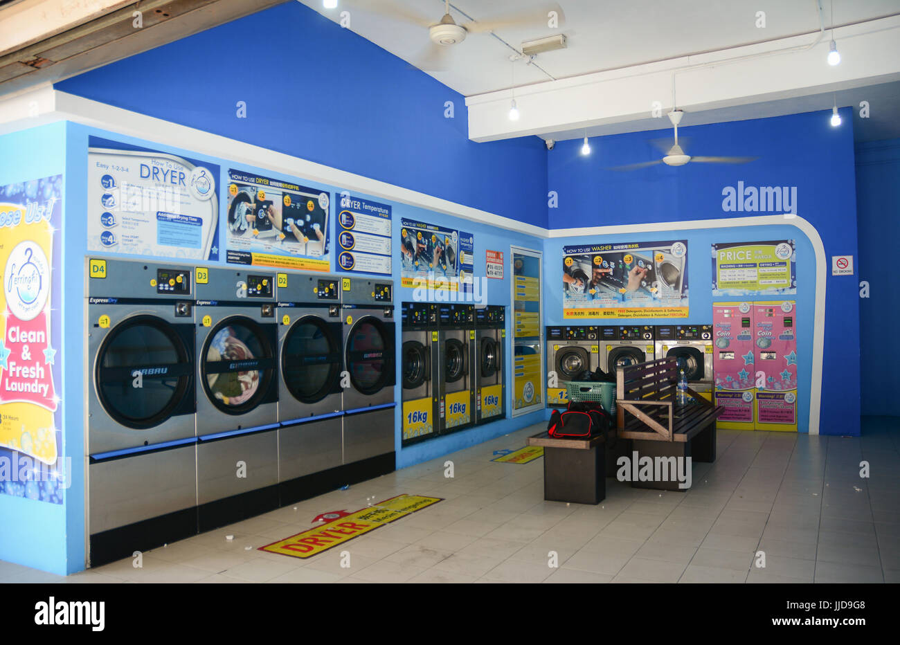 Penang, Malaysia - Mar 10, 2016. Automatic washing machines at laundry service in Penang, Malaysia. Stock Photo