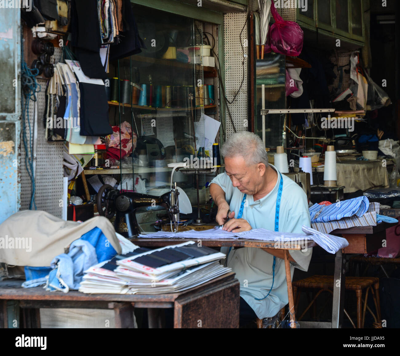 Malaysia Mar 10, 2016. Street tailor with his old