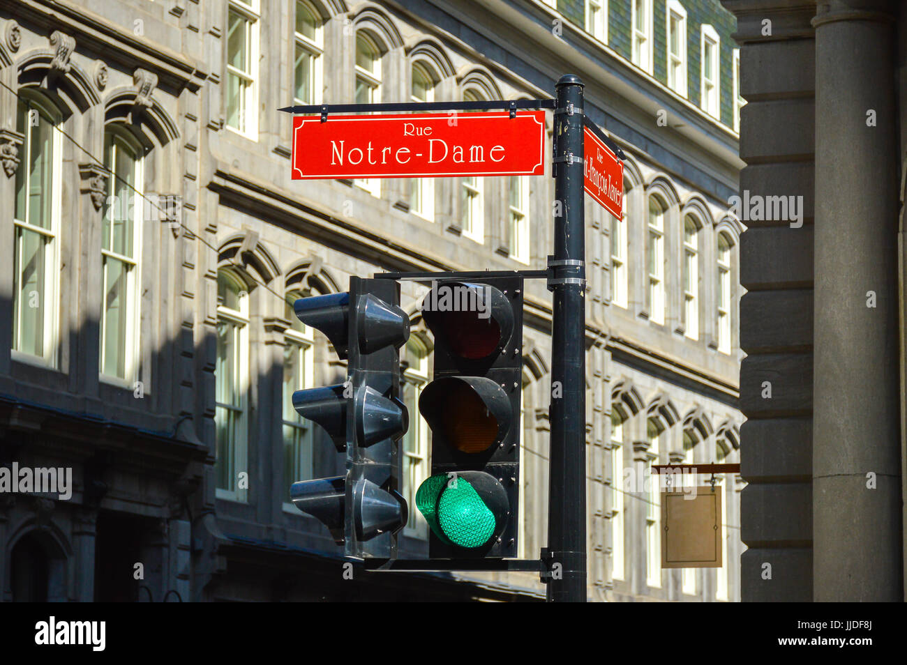 Old Montreal and Old Port green traffic light at Notre-Dame street, Canada Stock Photo