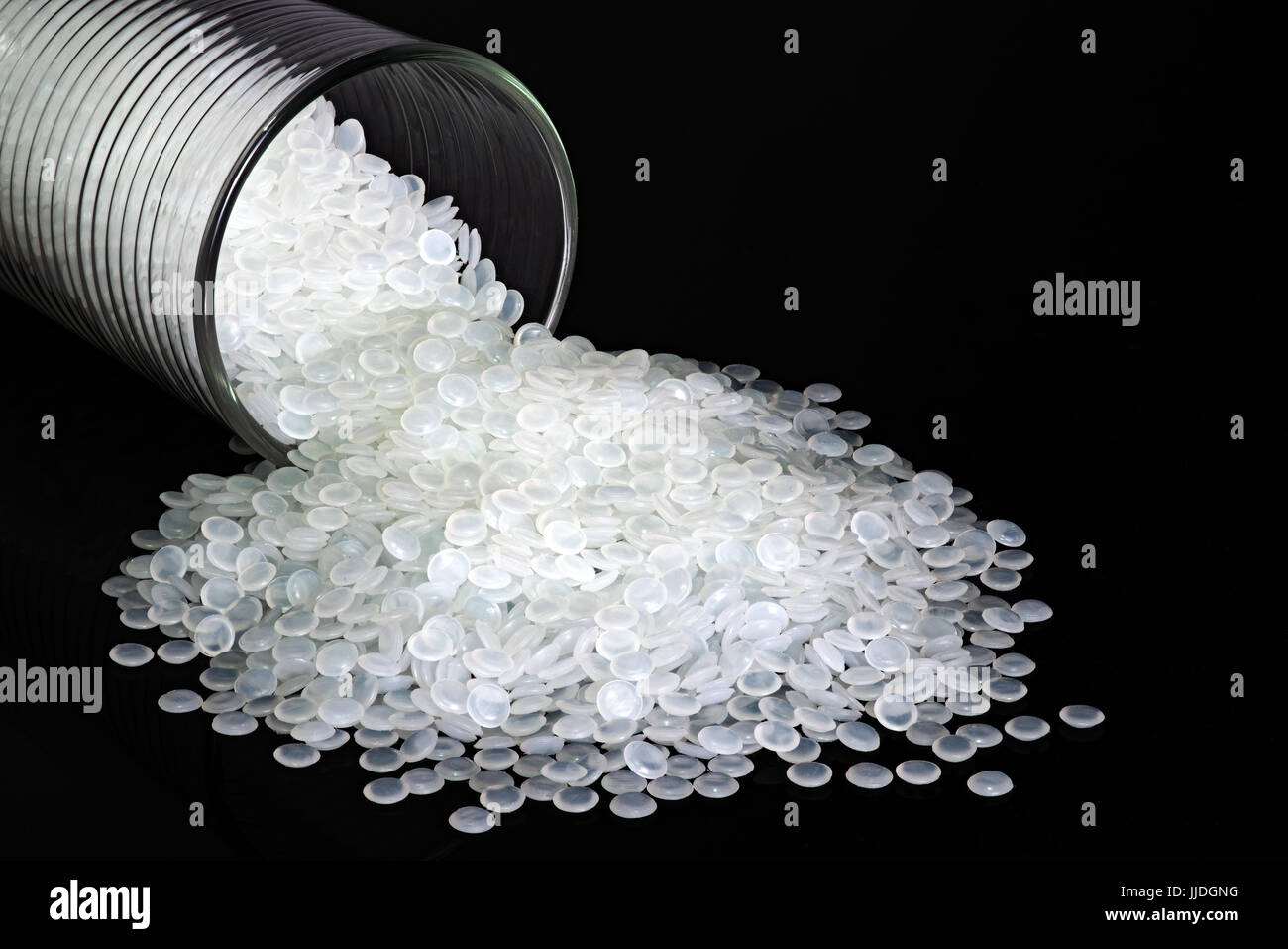 Polypropylene beads plastic pellets on black color background. Stock Photo