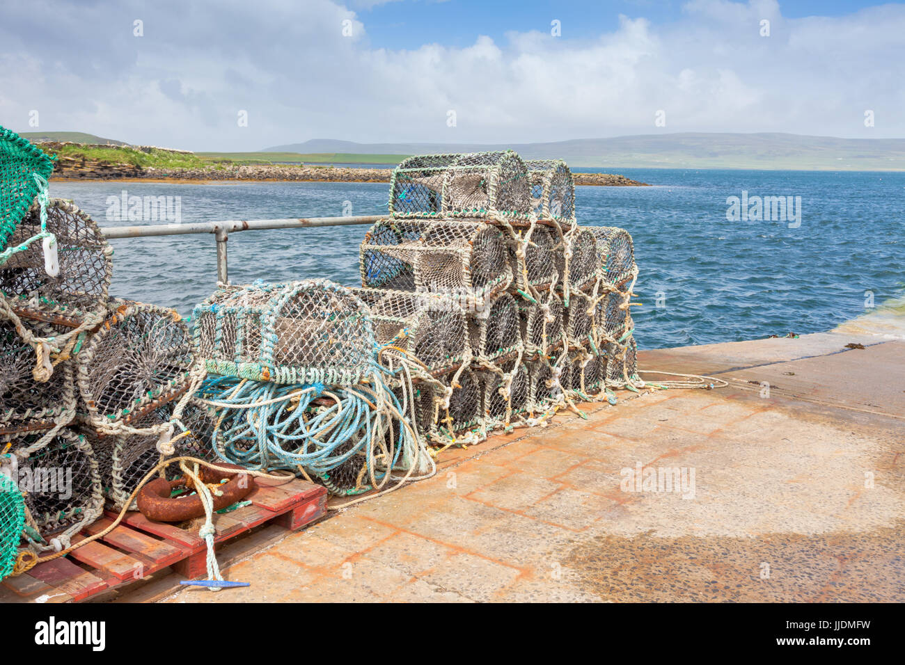 Lobster pots stacked on a quayside, Orkney UK Stock Photo