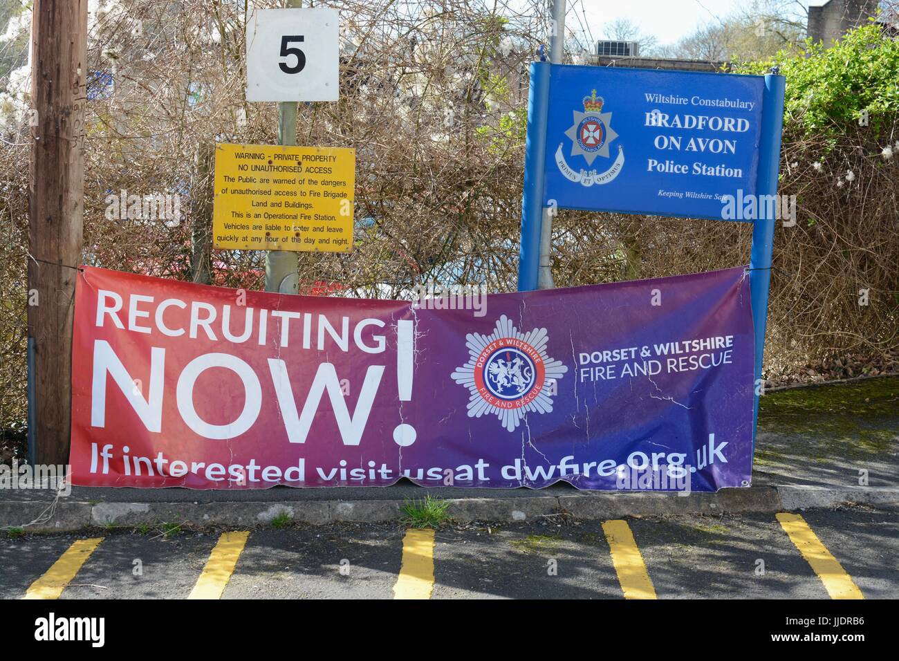 Recruitment banner for firefighters outside Bradford on Avon police and fire station Stock Photo