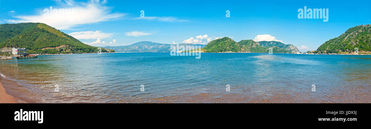 panoramic view of Aegean sea bay withgreen islands from Icmeler beach against clear blue sky, Turkey Stock Photo