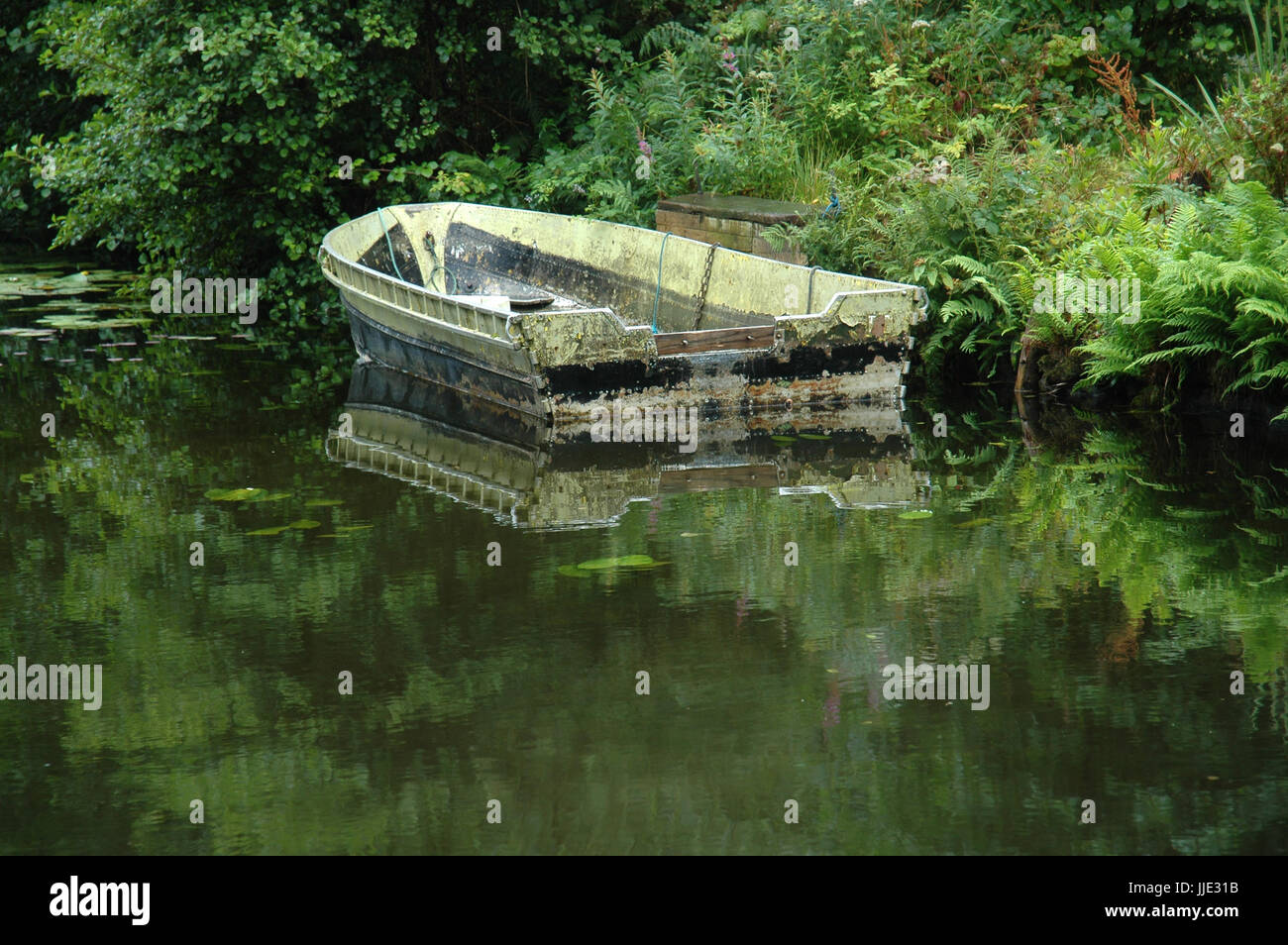 Old Boat on water in Mull Scotland Stock Photo