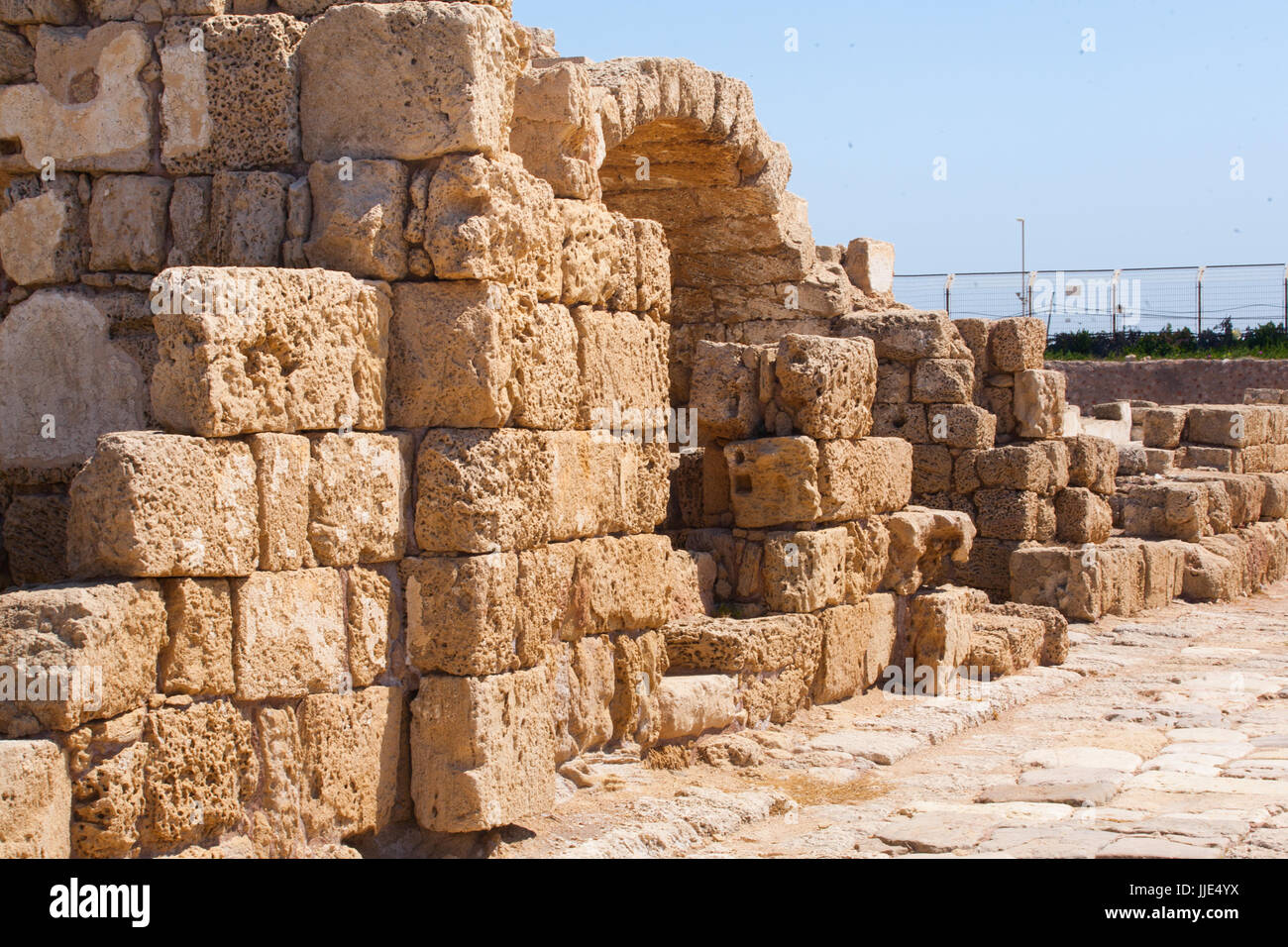 Roman falled stone wall with door in caesarea Archaeological site close to Herod the Great hippodrome Stock Photo