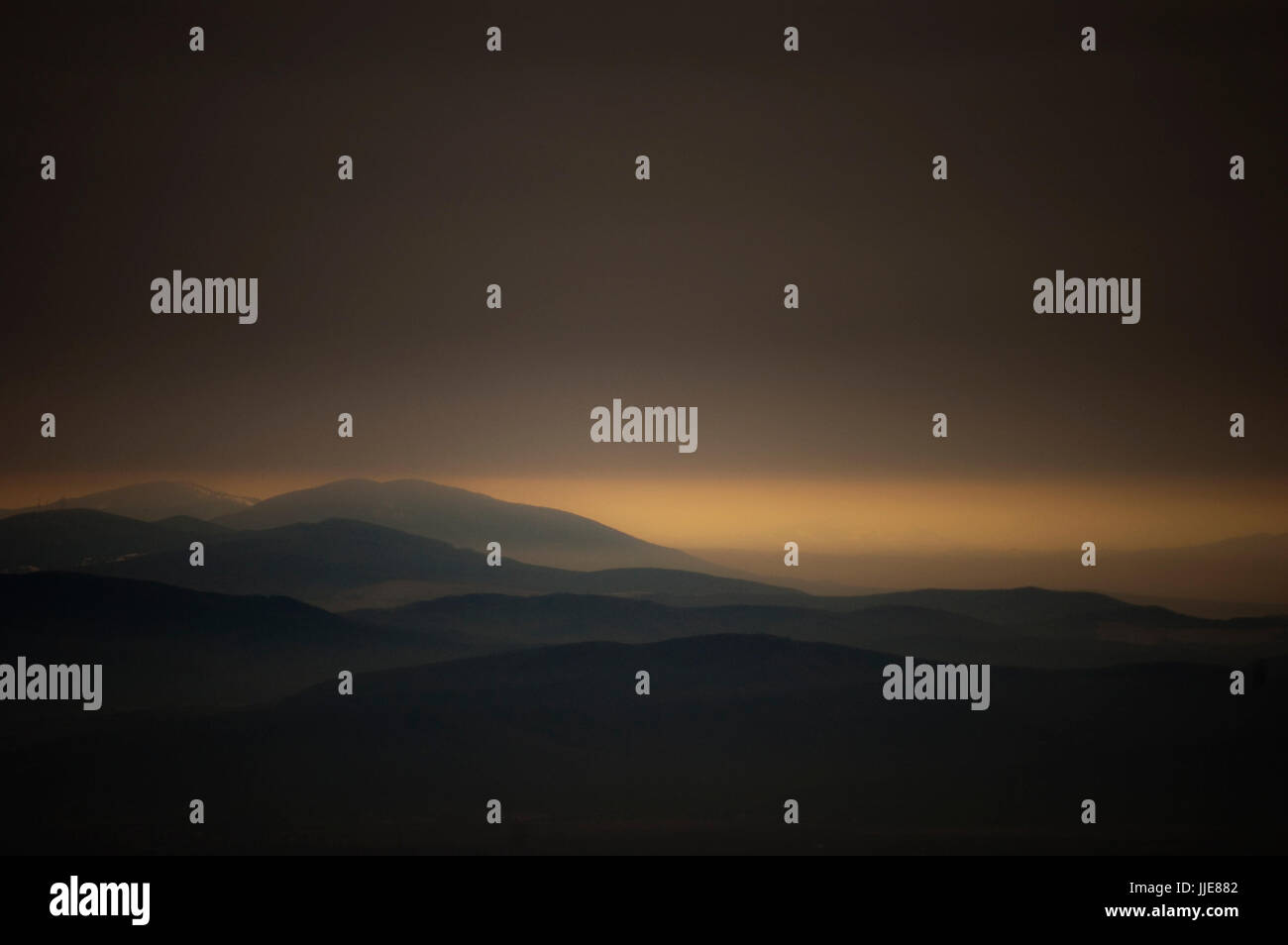 dark sky landscape with mountains and hills Stock Photo