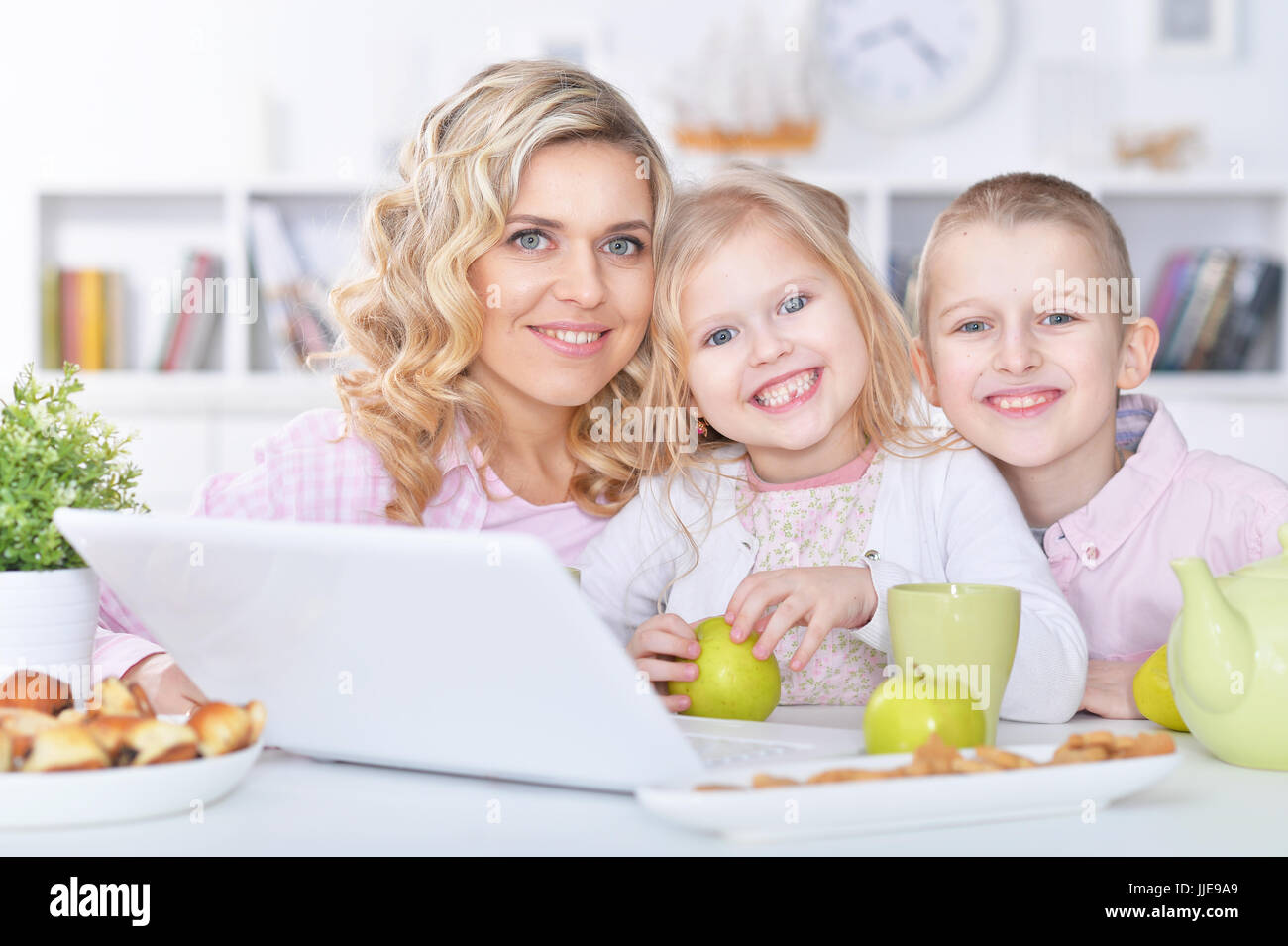 mother and children with laptop Stock Photo - Alamy