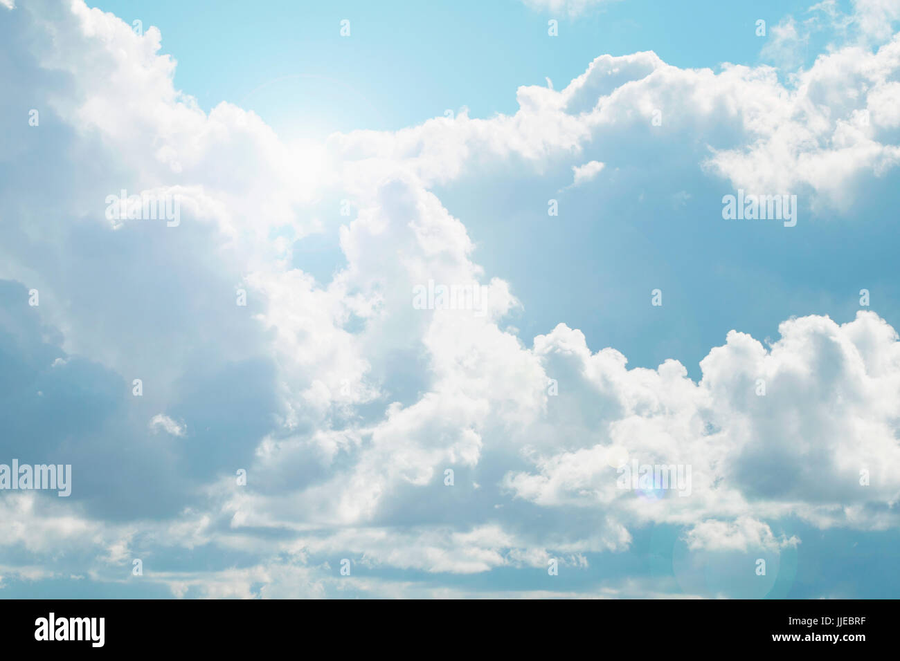 A blue sky with beautiful large fluffy clouds on a sunny and clear day ...