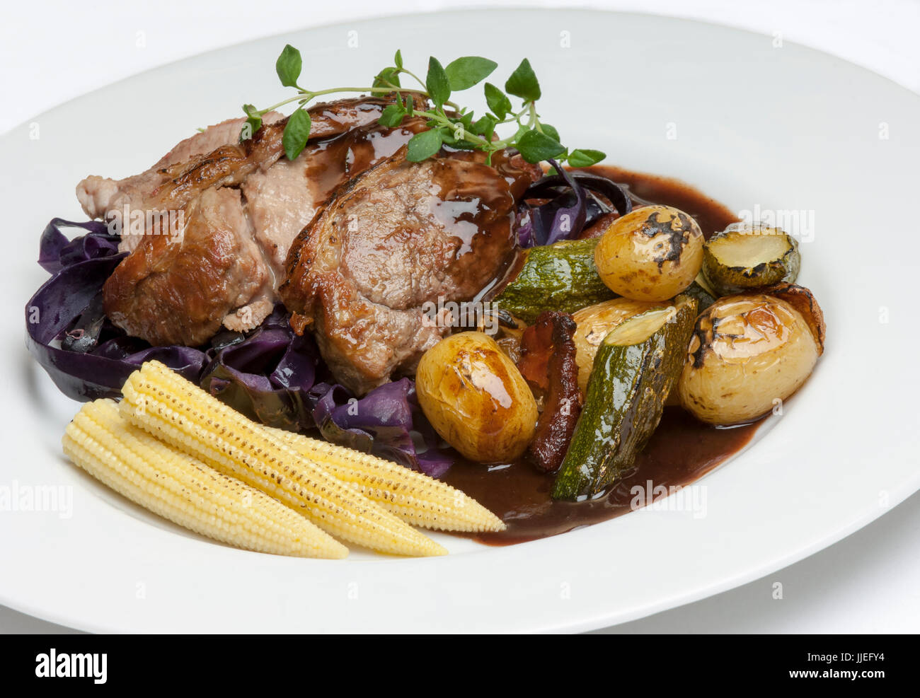 Roast Lamb "Henry" with roast vegetables in a rich red wine gravy Stock Photo Alamy