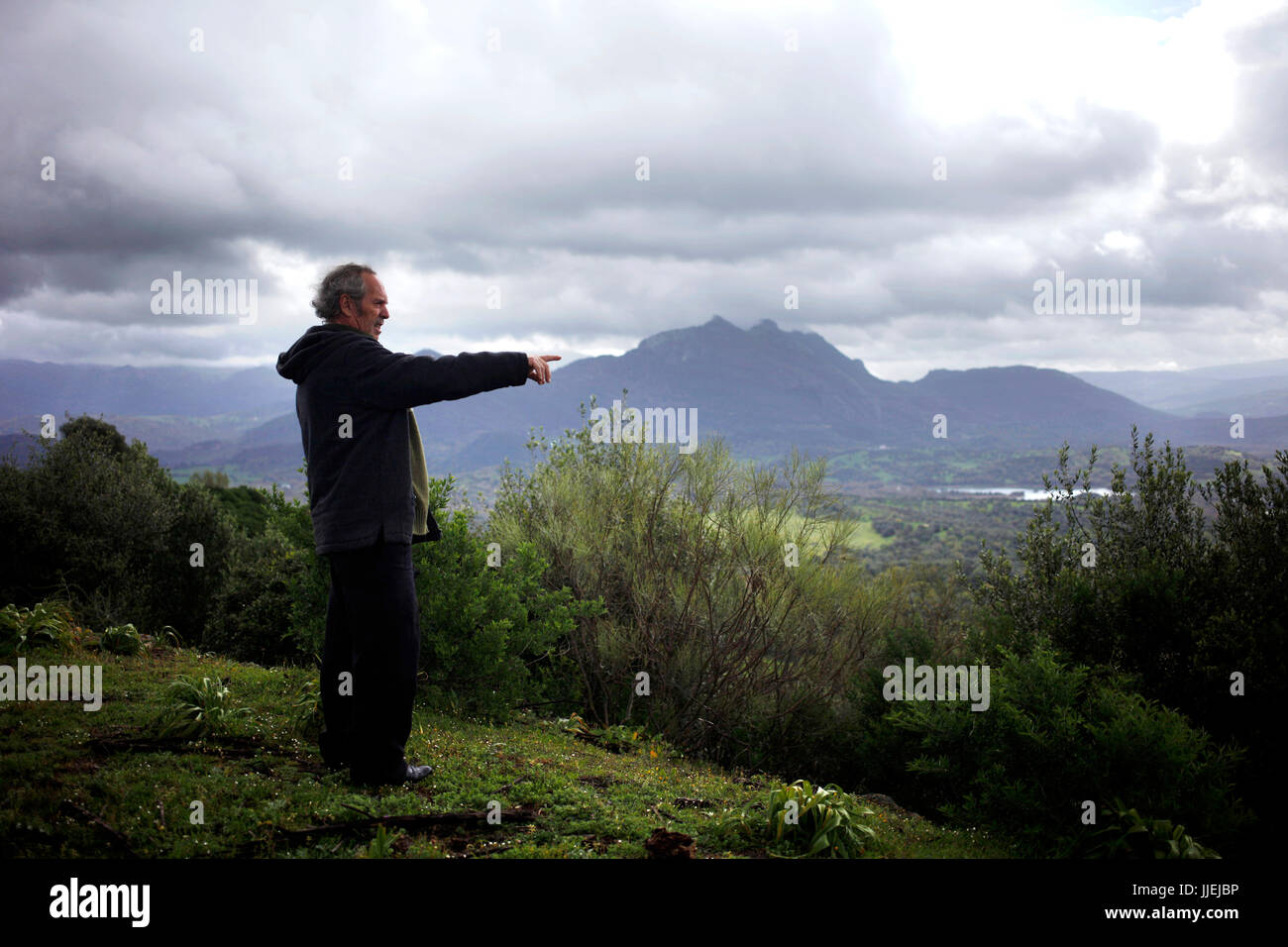 Poet and writer Joaqu’n Vazquez Manzano 'Miyelito' in the forest in Prado del Rey, Sierra de Cadiz, Andalusia, Spain Stock Photo