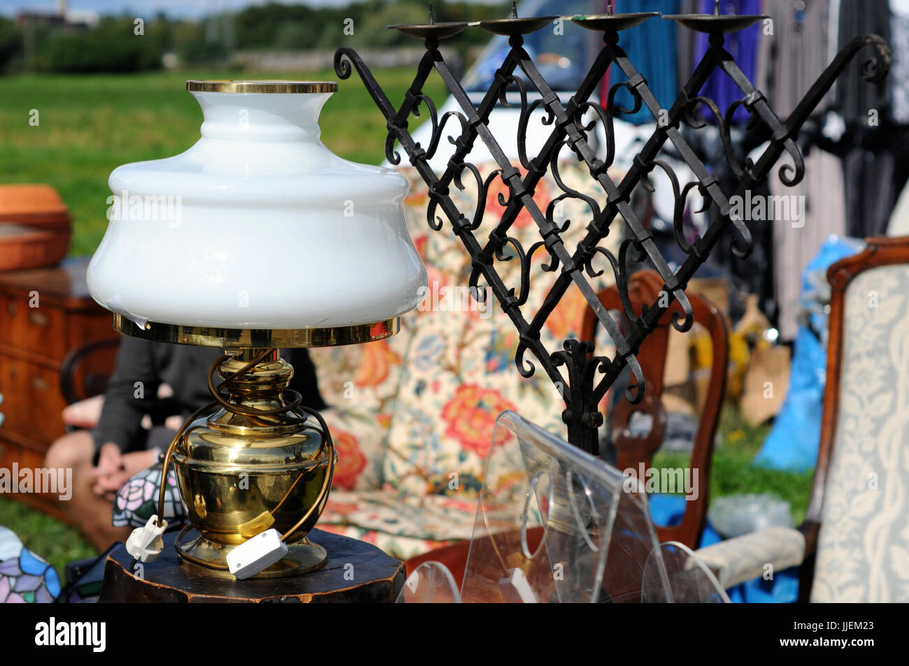 old paraffin lamp with iron candle holder Flea market Stock Photo Alamy