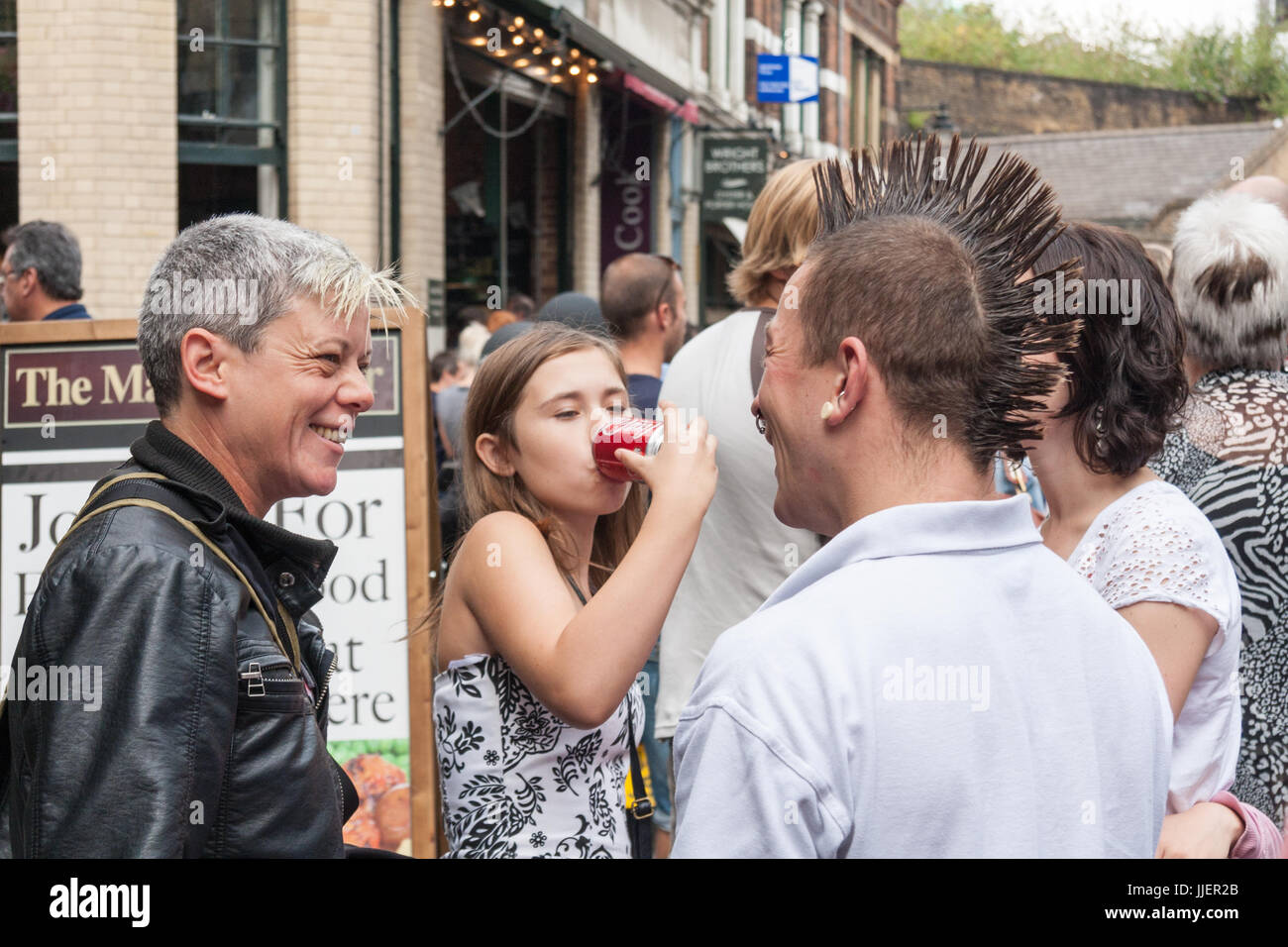 People drinking and talking outside the Market Porter pub, Borough Market, Southwark, London, England, United Kingdom Stock Photo