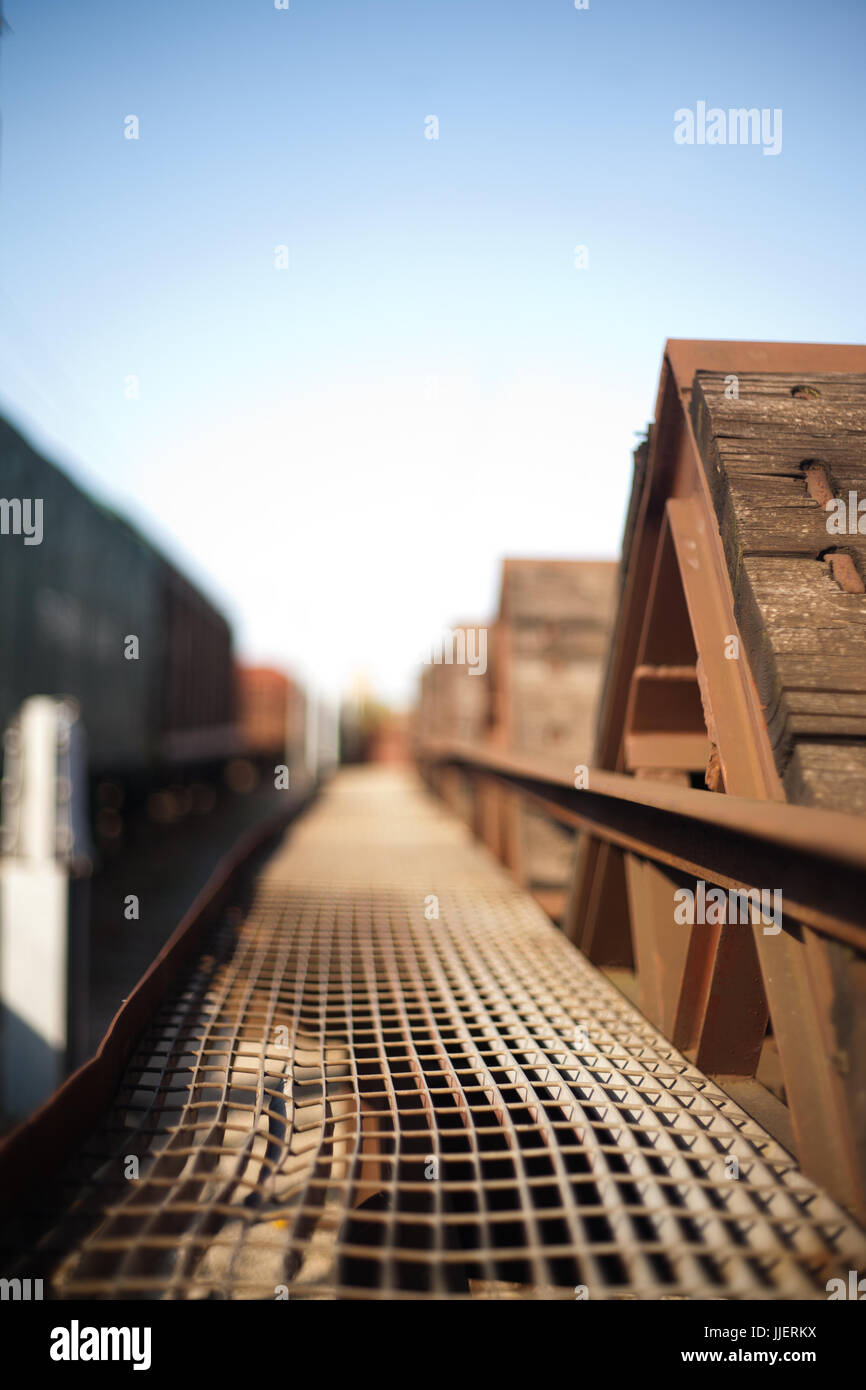 Heat-deformed metal net on a wooden freight train wagon Stock Photo