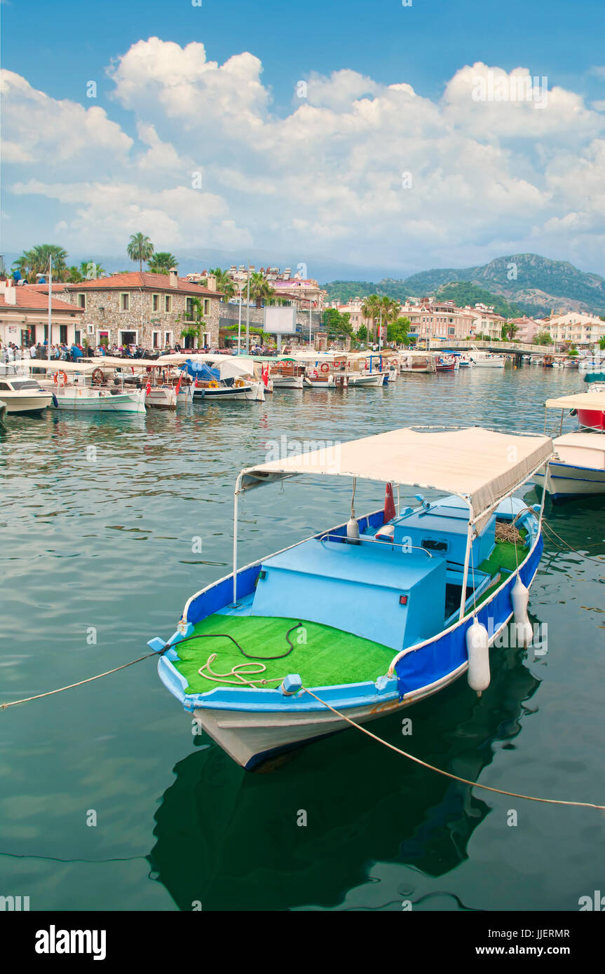 boats moored in canal surrounded by bars and restaurants in Marmaris, Turkey Stock Photo