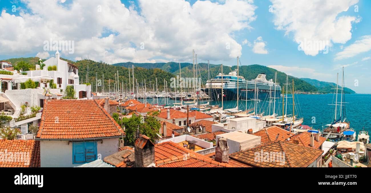 panoramic view of old town and marina with big cruise ship on sunny day, Marmaris, Turkey Stock Photo