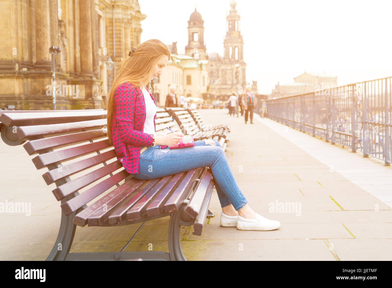 girl writes in the diary the impression of the tourist on Dresden Stock Photo