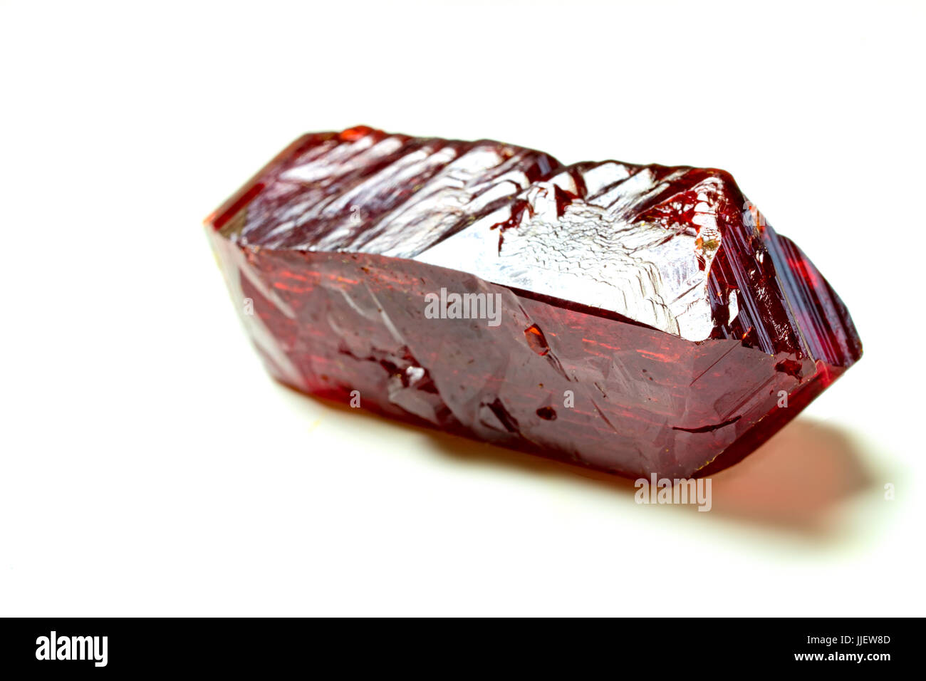 Red natural Geology crystals on white background. Red blood salt  Sodium ferrocyanide crystals Stock Photo