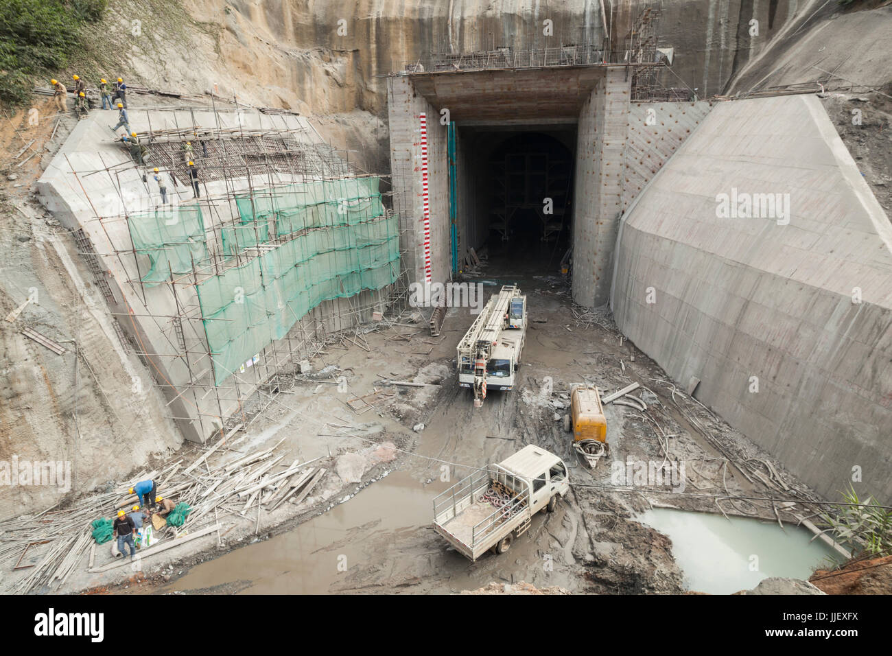 The entrance to the 600 m long diversion (box) dam at the site of Dam #6 on the Nam Ou River, Laos. The river would be diverted into this tunnel six days later (27 January 2014) to allow construction of the dam across the original river channel. Stock Photo
