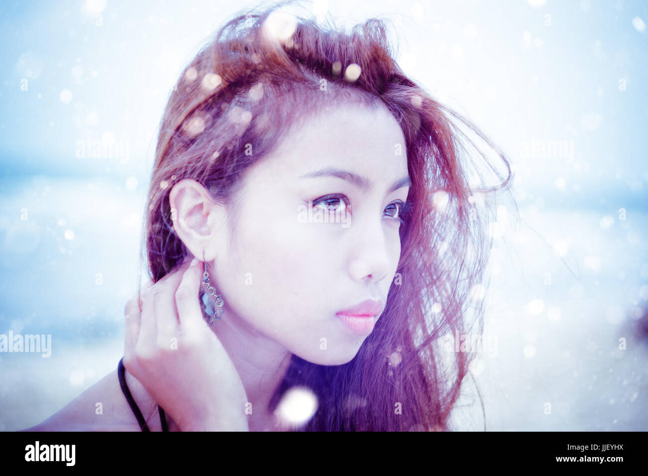 Portrait of a woman in the snow Stock Photo - Alamy