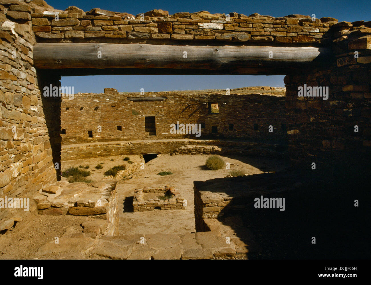 Interior of Casa Riconada great kiva seen from antechamber of main (S) entrance, Chaco Canyon, New Mexico: shows N entrance with hidden entrance below Stock Photo