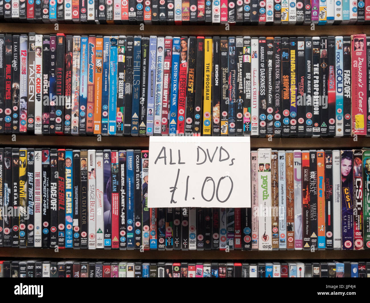 A close up of DVDs for sale on a market stall in the UK Stock Photo
