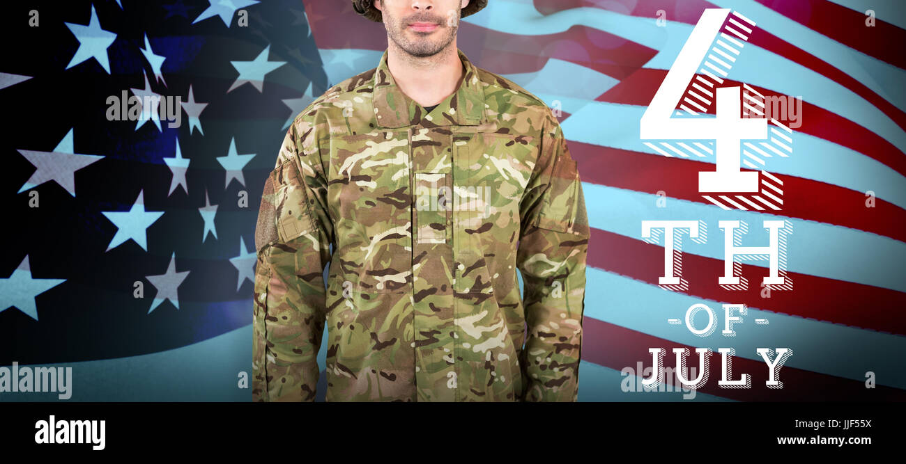 Portrait of confident soldier standing against white background against ...