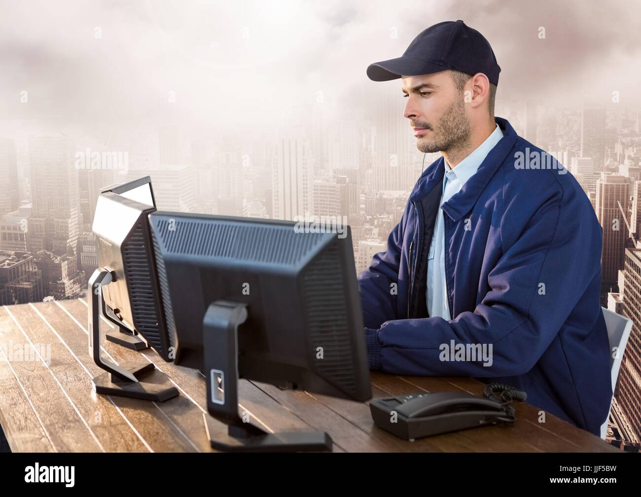 Securityman Photopc Digital composite of Security man on computer over large city Stock ...
