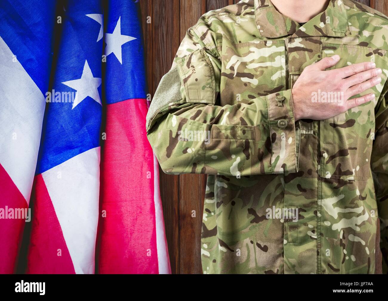 Digital composite of soldier with the hand on the hearth and the usa ...