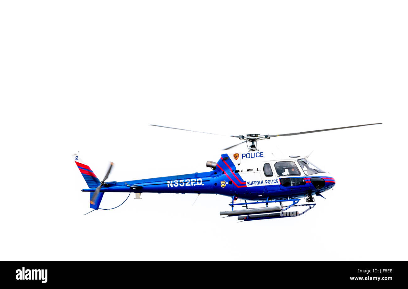 Suffolk County Police helicopter in flight over Sag Harbor's Haven's Beach in Eastern long island Stock Photo
