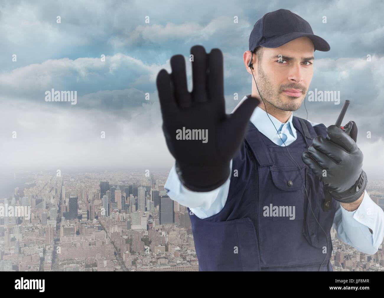 Digital composite of Security guard with walkie talkie and hand up ...