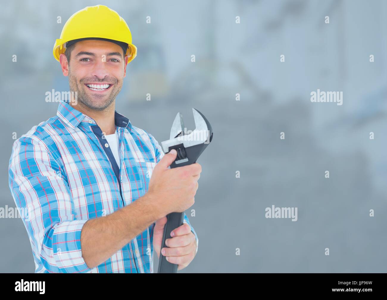 Person Using Wrench Digital composite of Construction Worker with wrench tool in front of ...