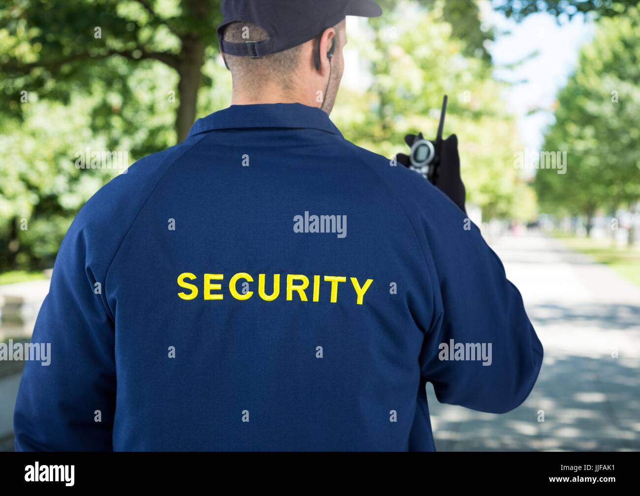 Digital composite of Security man outside in park Stock Photo - Alamy