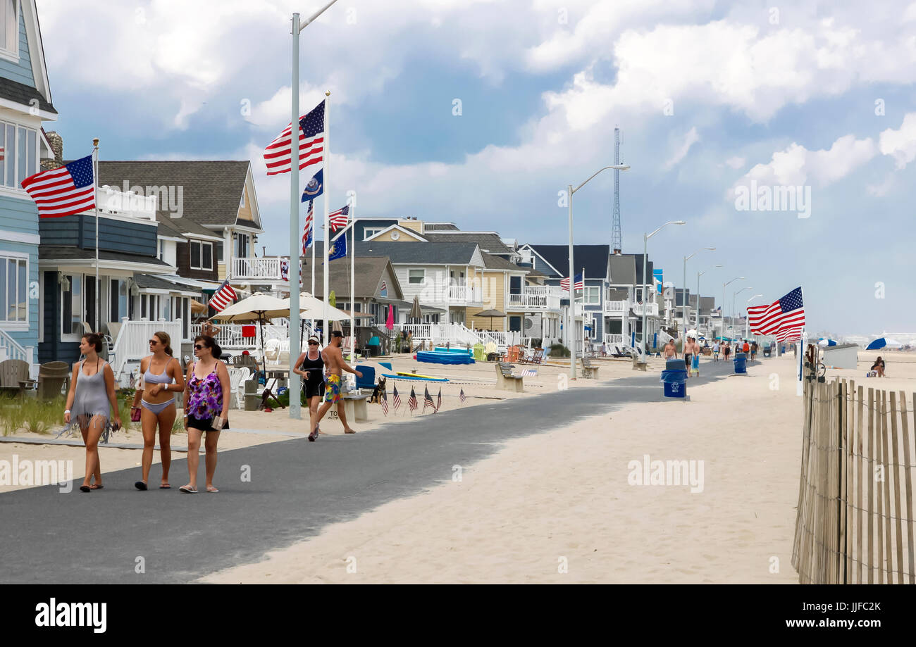 People strolling along Manasquan's beach front walkway in New Jersey. Stock Photo