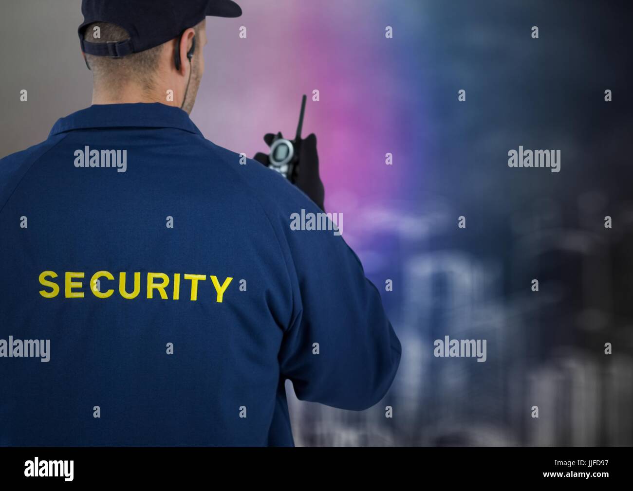 Digital composite of Back of security guard with walkie talkie against blurry wall with building sketch Stock Photo