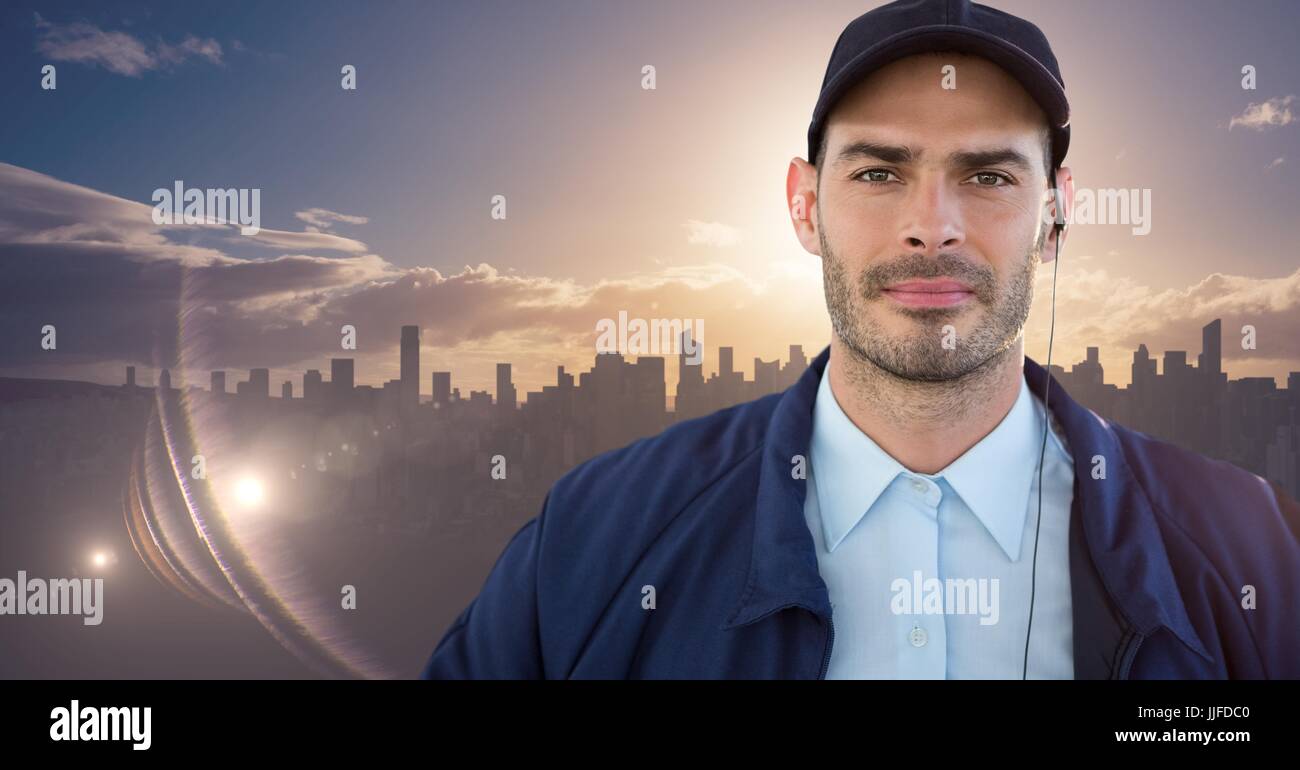 Digital composite of Security guard against skyline with sunset Stock Photo