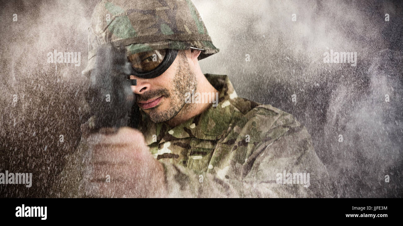 Portrait of soldier aiming with rifle against dark background Stock ...