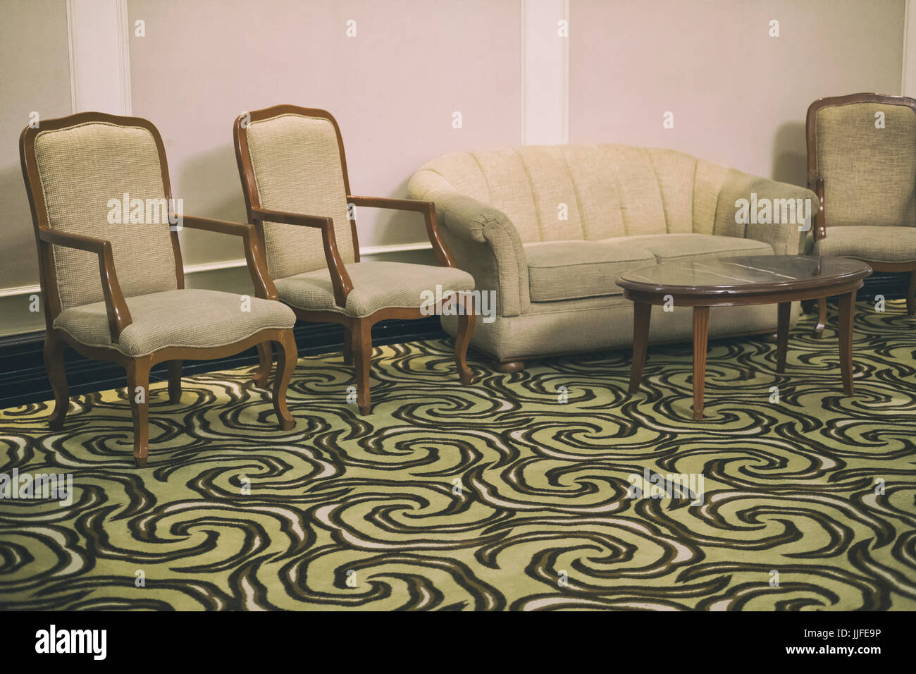 Living room interior with beige fabric sofa and armchair Stock Photo ...
