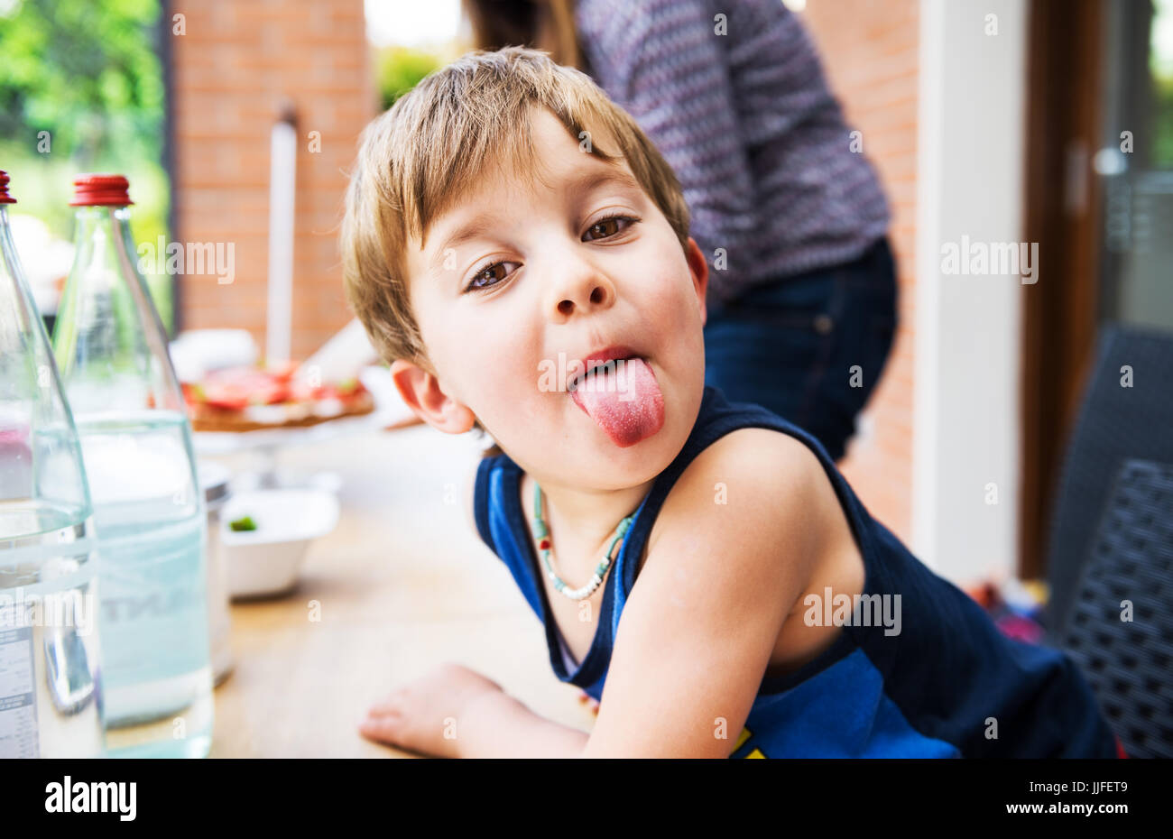 Child making a tongue Stock Photo