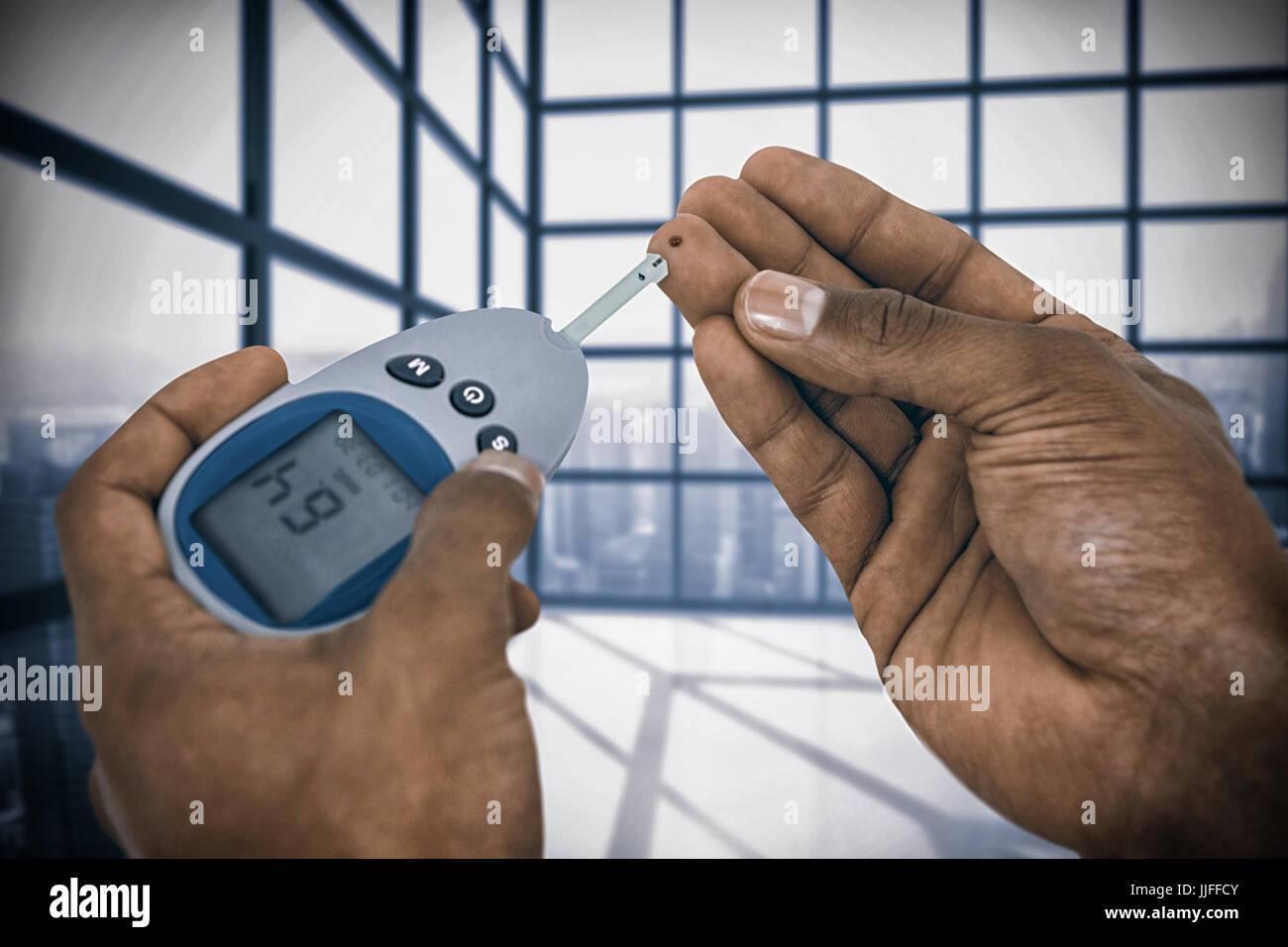 Close up of man hands testing blood sugar with against room