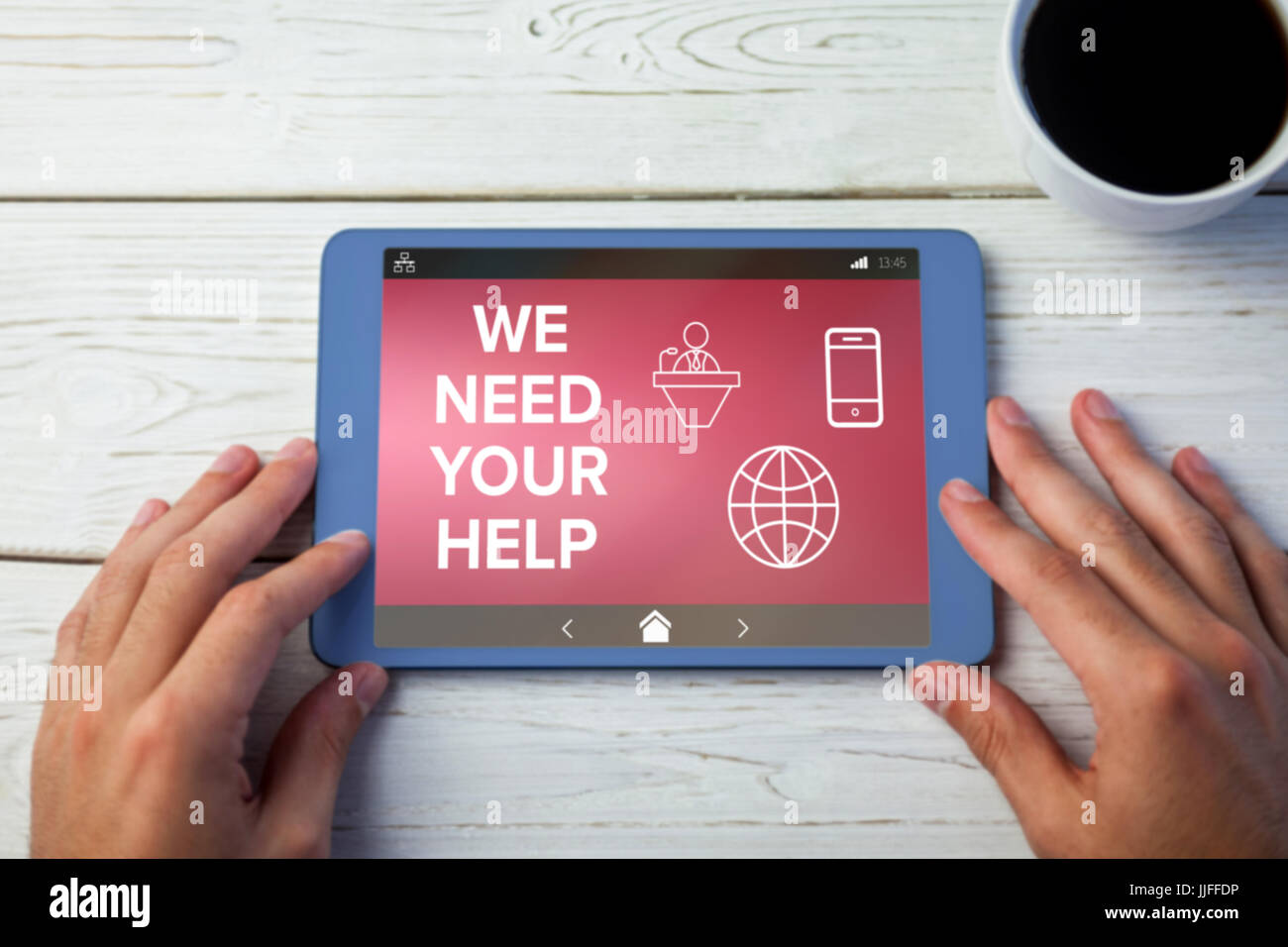 We Need your Help text with various icons on screen against hands using ...