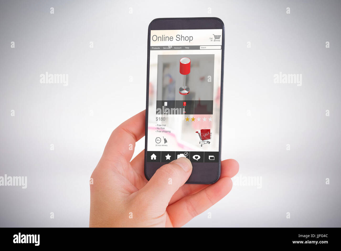 Female hand holding a smartphone against grey background Stock Photo ...