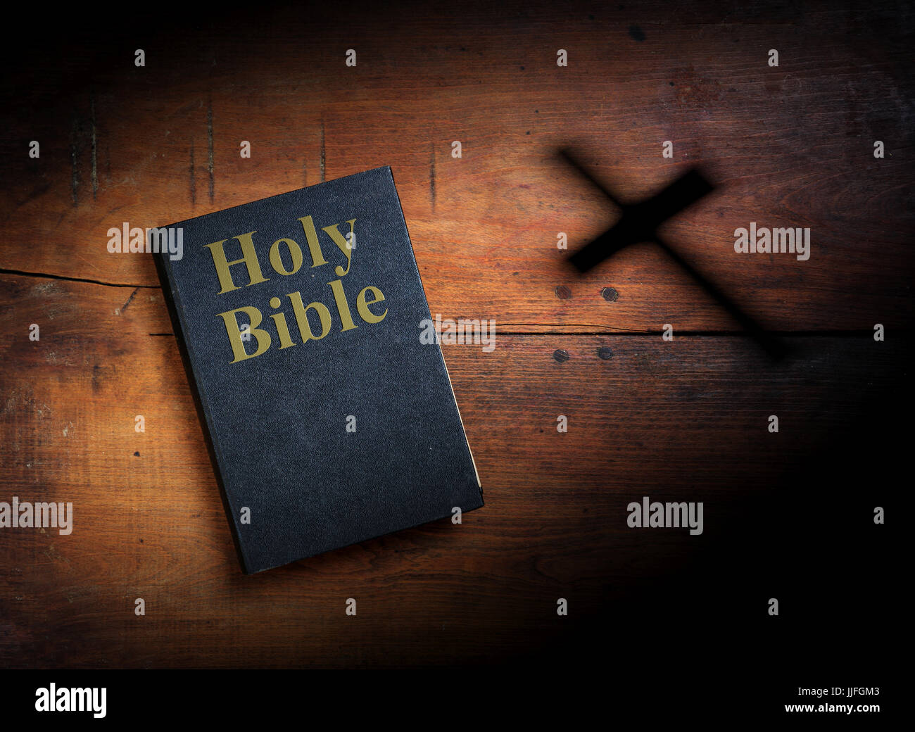 Old Holy Bible on wooden planks background Stock Photo - Alamy
